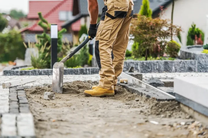 Lee-Built Construction worker installing a concrete path.