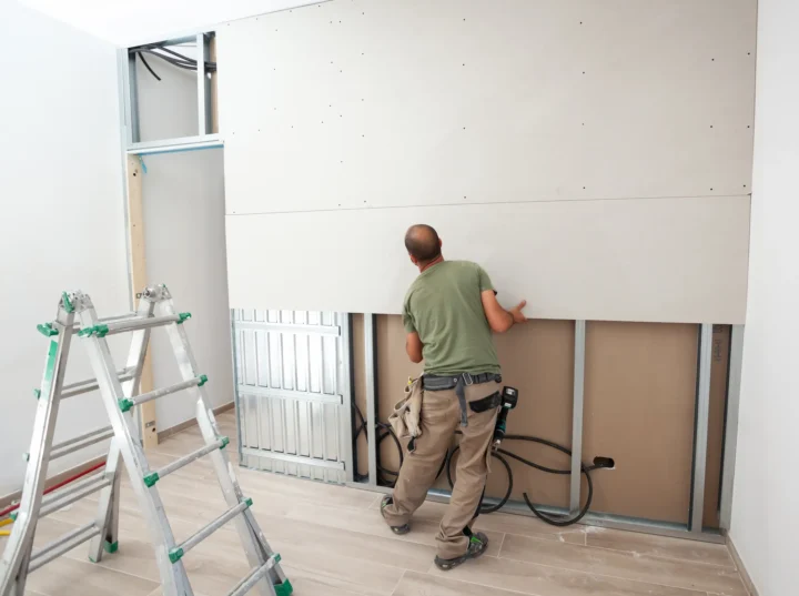 Drywall being installed in an office by Lee-Built Construction.
